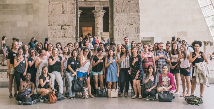 A large group doing team building at the museum.